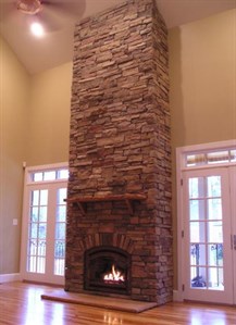 stone fireplace up to the ceiling
